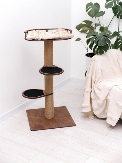 small cat tree with cat cushion on the top